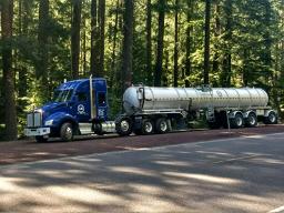 L&R Group Truck pulled over for a break in the forest.